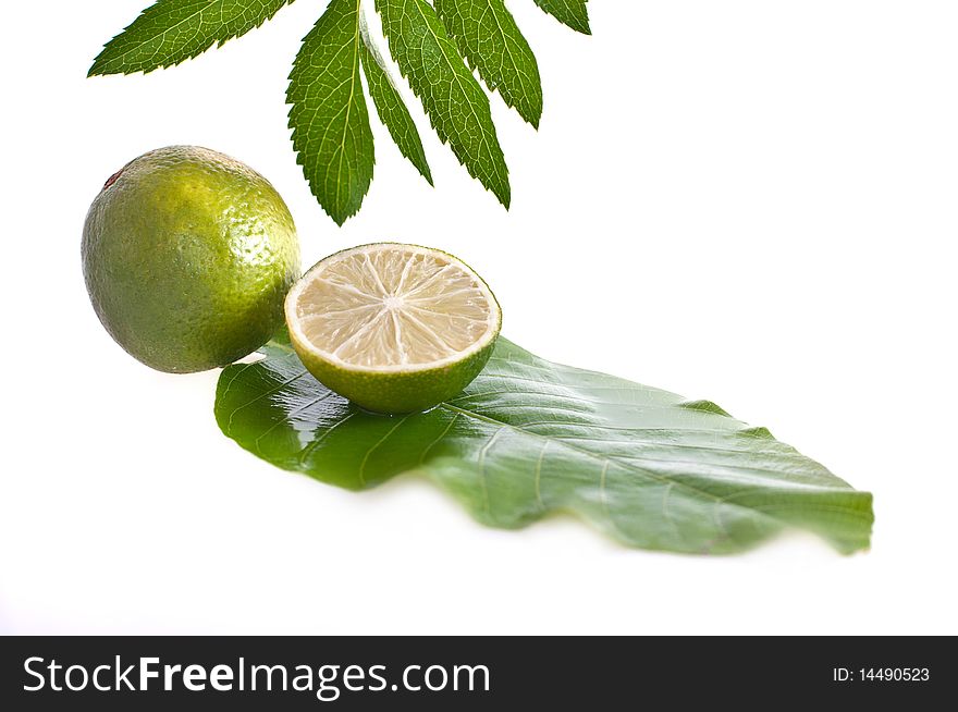 Lime with leaf, isolated on white background