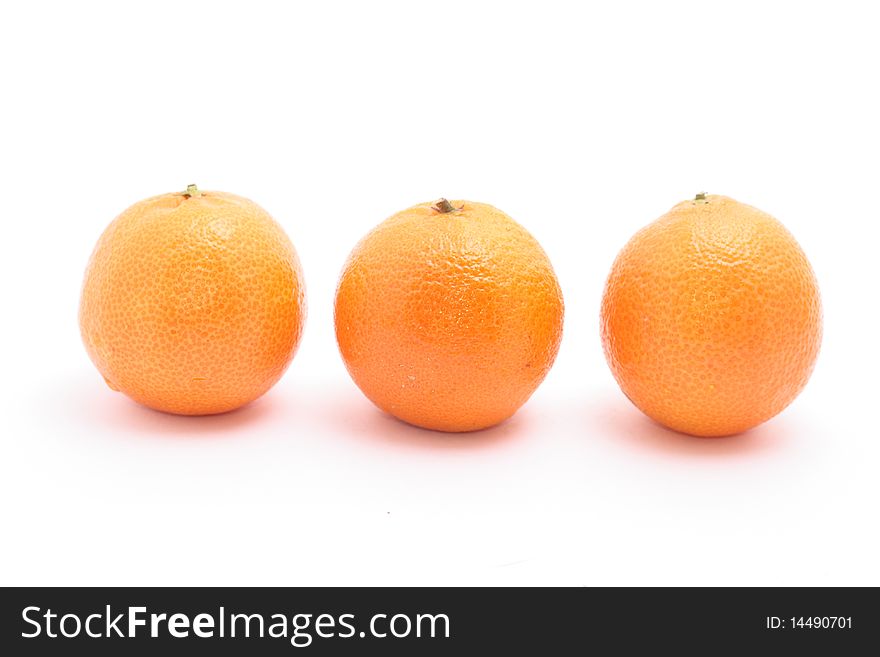 Three tangerine isolated on white