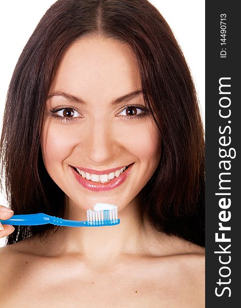 Beautiful young woman holding toothpaste and toothbrush, white background. Beautiful young woman holding toothpaste and toothbrush, white background