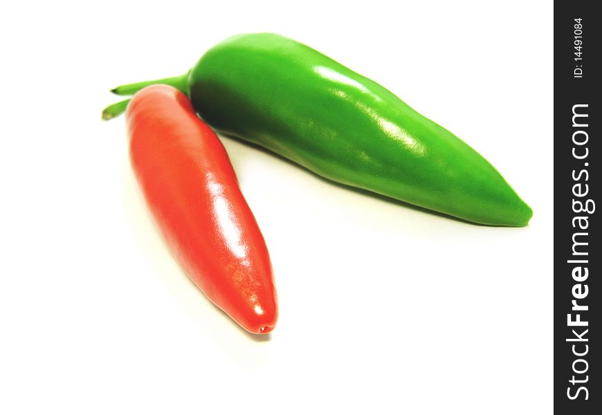 Green and red pepper closeup isolated shot. Green and red pepper closeup isolated shot
