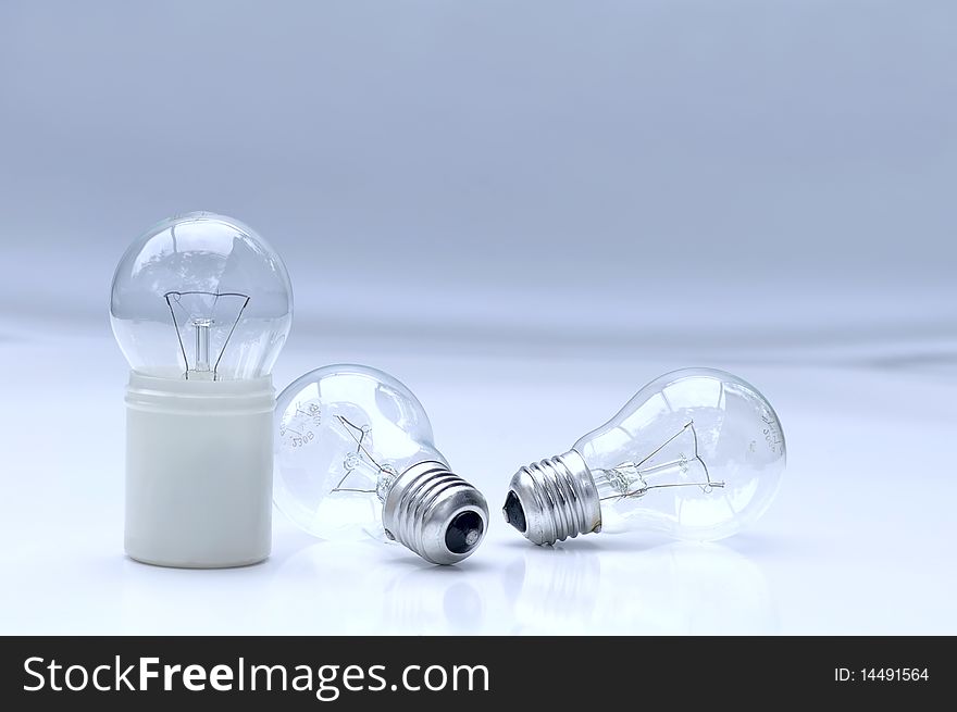 Several electric lamps on light background