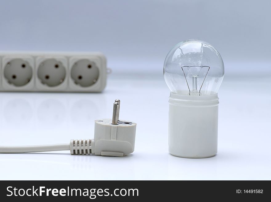 Electric lamp with extension plug-wire on light background. Electric lamp with extension plug-wire on light background