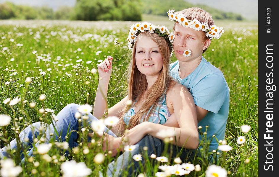 Pretty young couple in the fields