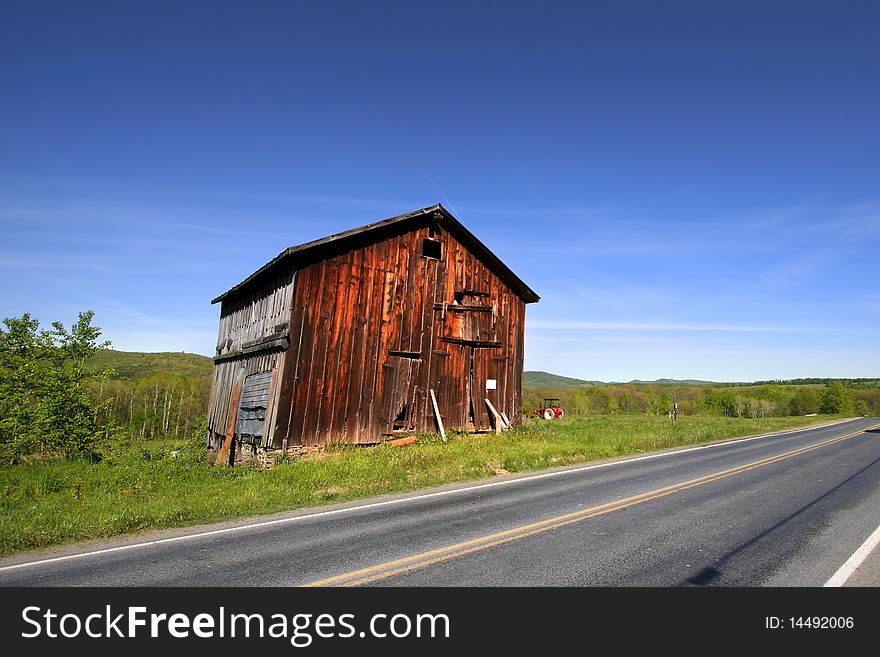 Old abandoned barn by the high way. Old abandoned barn by the high way