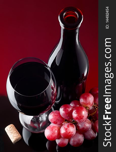 Red wine and grapes