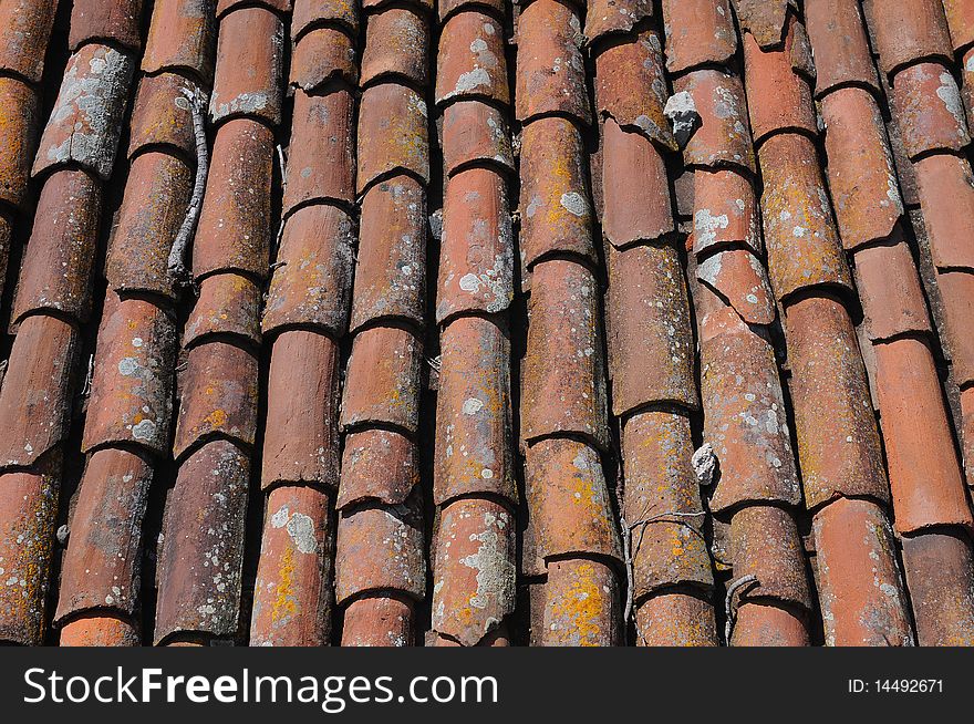 Old red tiled roof background