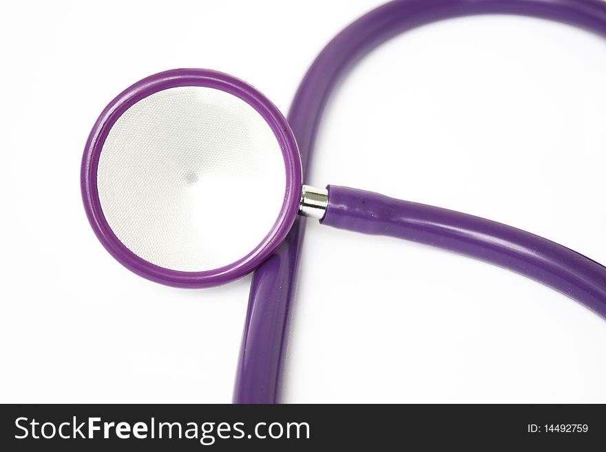 Pruple stethoscope on a white background