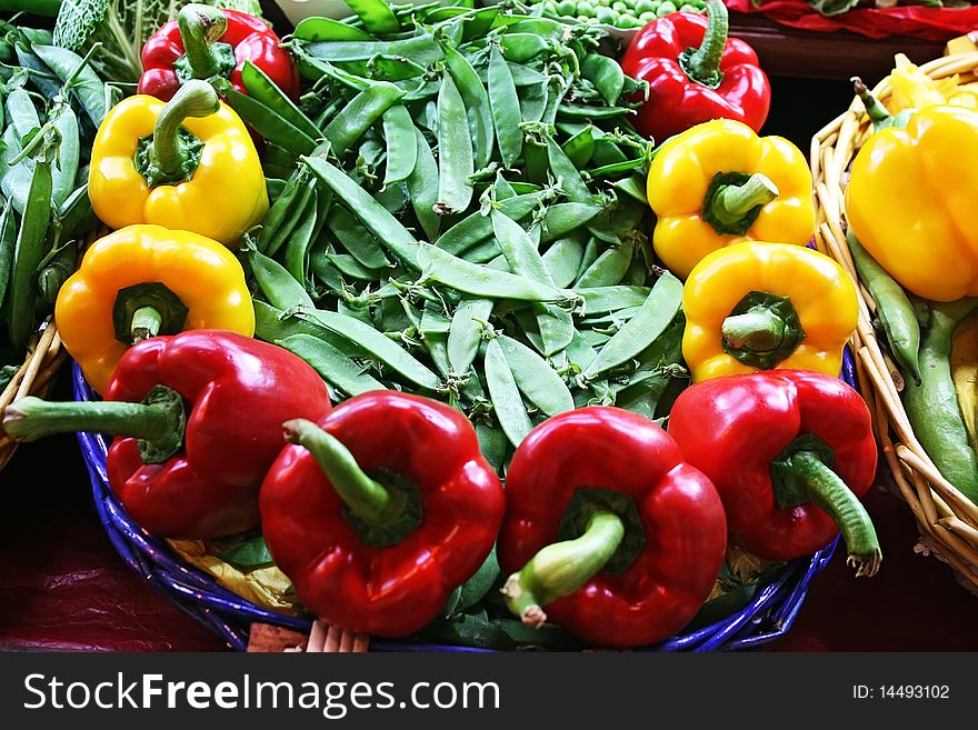 Yellow and red bell pepper with peas