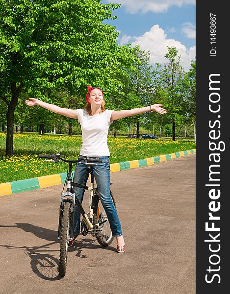 Outdoor shoot of young woman with bicycle