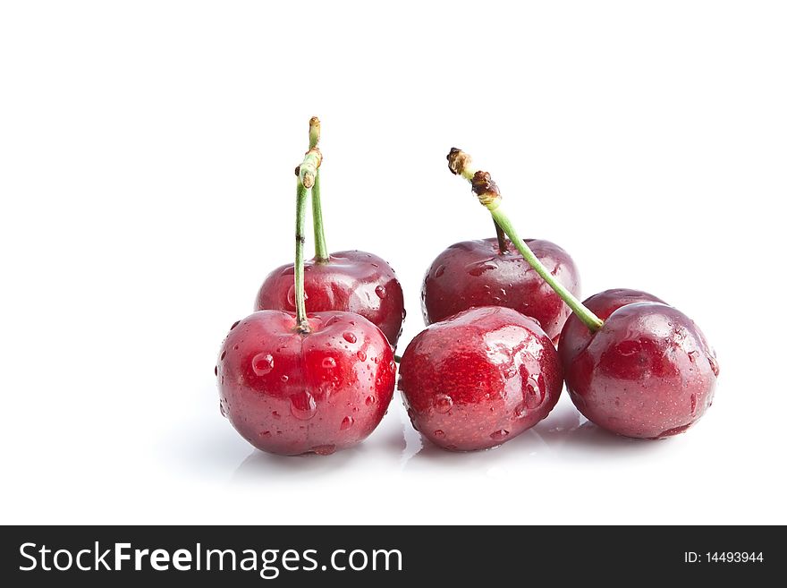 A group of cherries with water droplets. A group of cherries with water droplets
