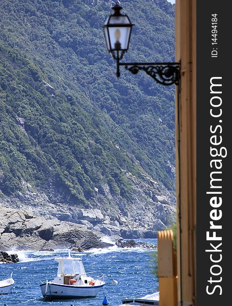 A particular view of italian riviera with the sea through the mountains and the houses. A particular view of italian riviera with the sea through the mountains and the houses.