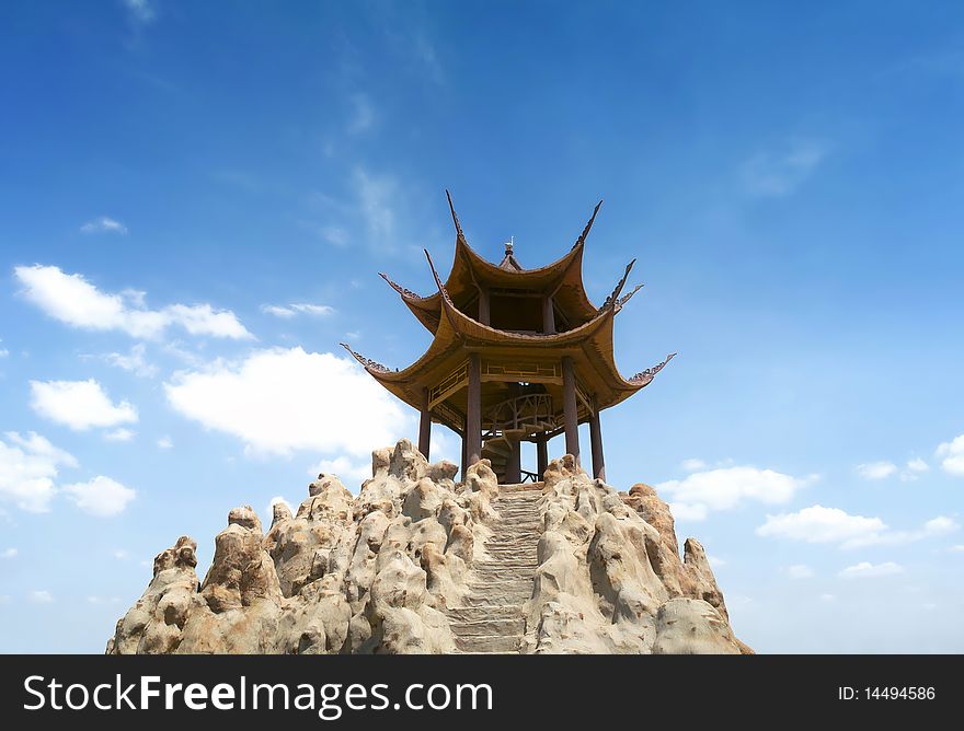 Pavilion in chinese garden under blue sky