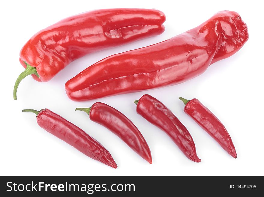 Sweet red peppers and chillies selection over white