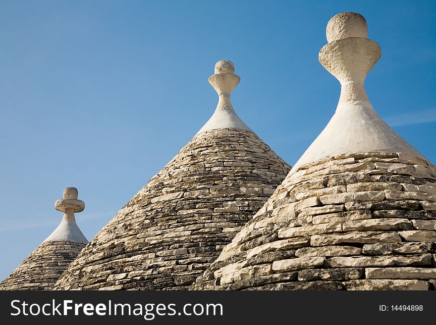 Trulli house in Italy, specific conical roofed houses in Apulia. Unesco World Heritage site famous as a top travel destination in Apulia. Trulli house in Italy, specific conical roofed houses in Apulia. Unesco World Heritage site famous as a top travel destination in Apulia