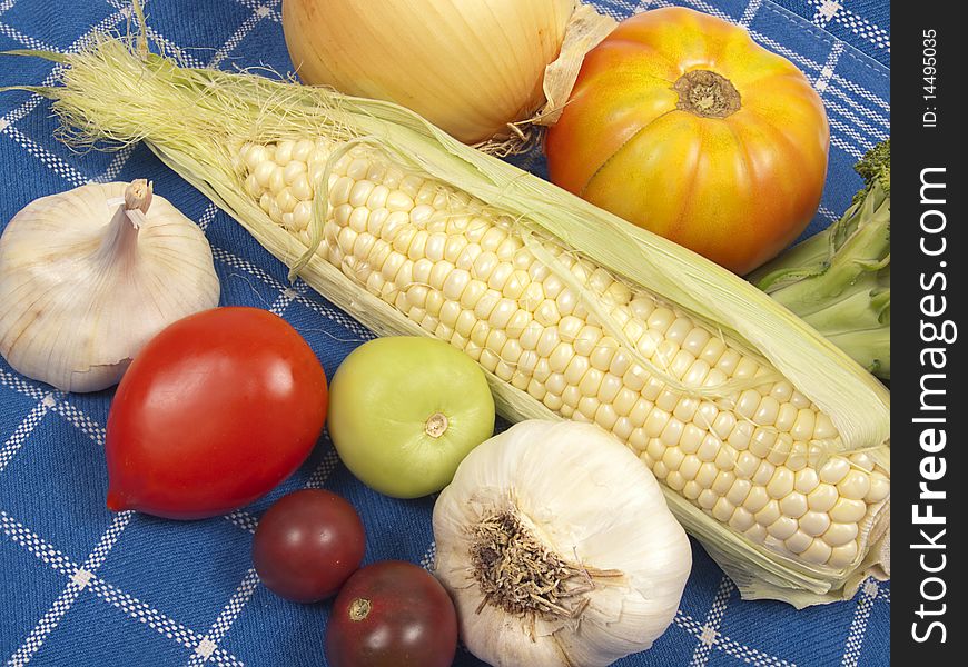 Fresh Raw Vegetables On Blue Cloth