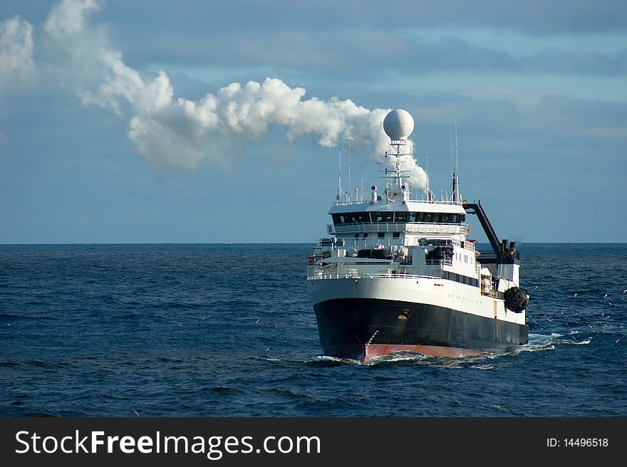 Catcher boat in antarctic area near icebergs Orkney Islands