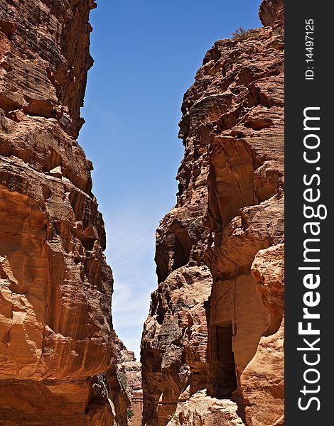 The Siq, the narrow slot-canyon that serves as the entrance passage to the hidden city of Petra, Jordan