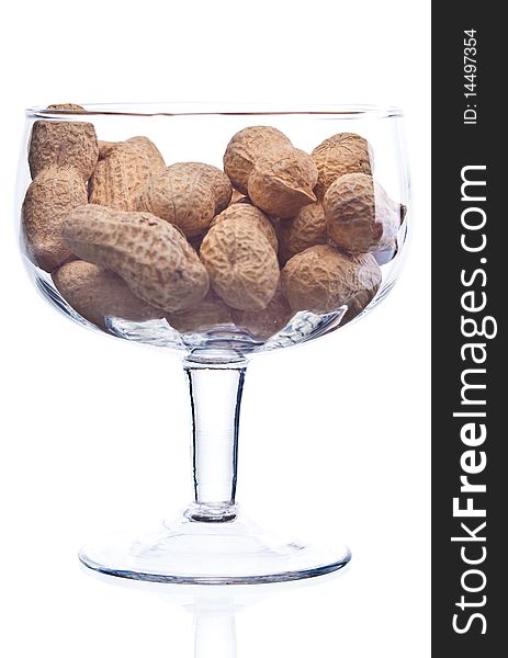 Roasted peanuts in glass isolated on white