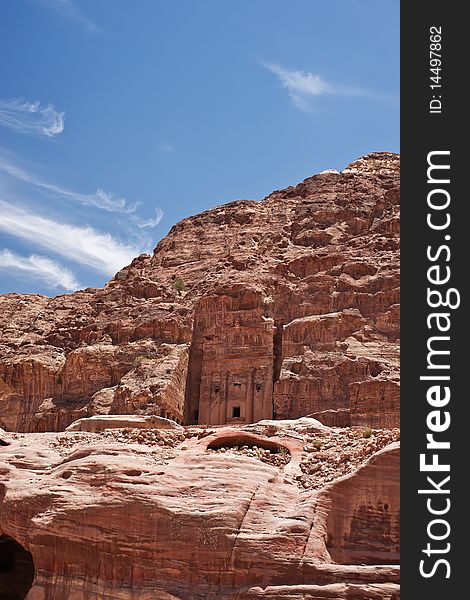 The large cliff side tomb carved from the beautiful richly-colored sandstone in the ancient city of Petra, Jordan