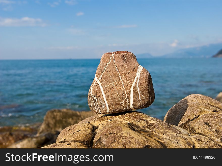 Small stone on a marine coast