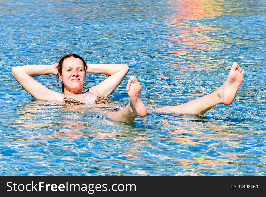 Young woman relaxing in the sea. Young woman relaxing in the sea