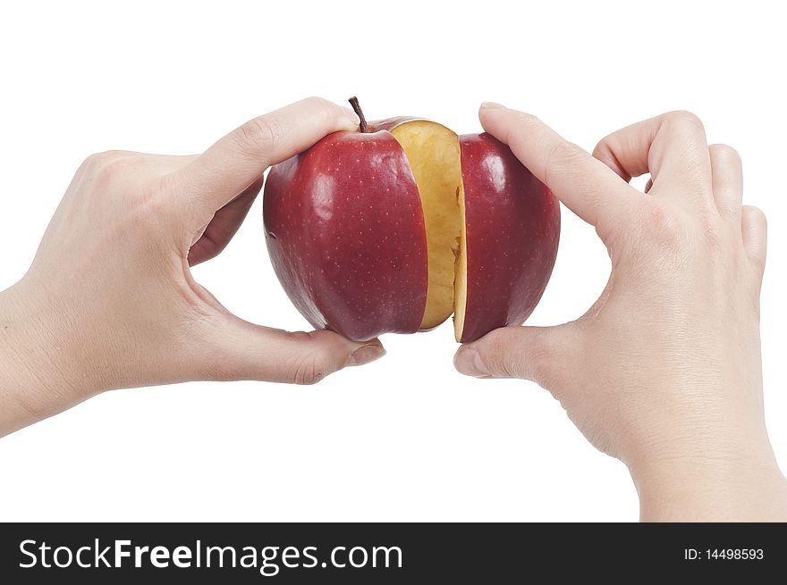 Hands holding a red sliced Apple (with clipping path). Hands holding a red sliced Apple (with clipping path)