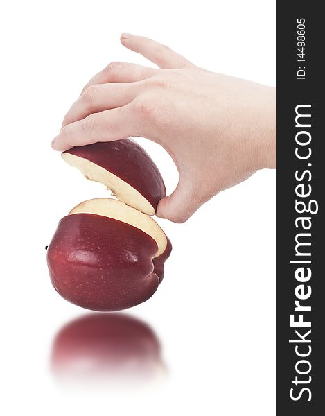 Hand taking a slice of red Apple (clipping path included). Hand taking a slice of red Apple (clipping path included)