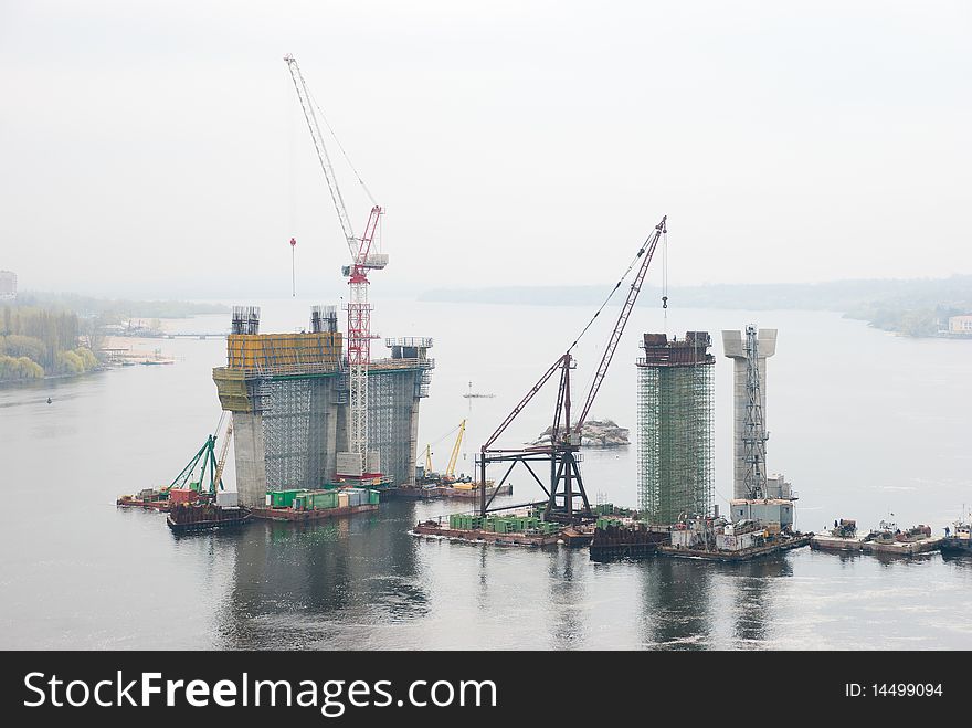 Construction of a bridge over the river. Construction of a bridge over the river