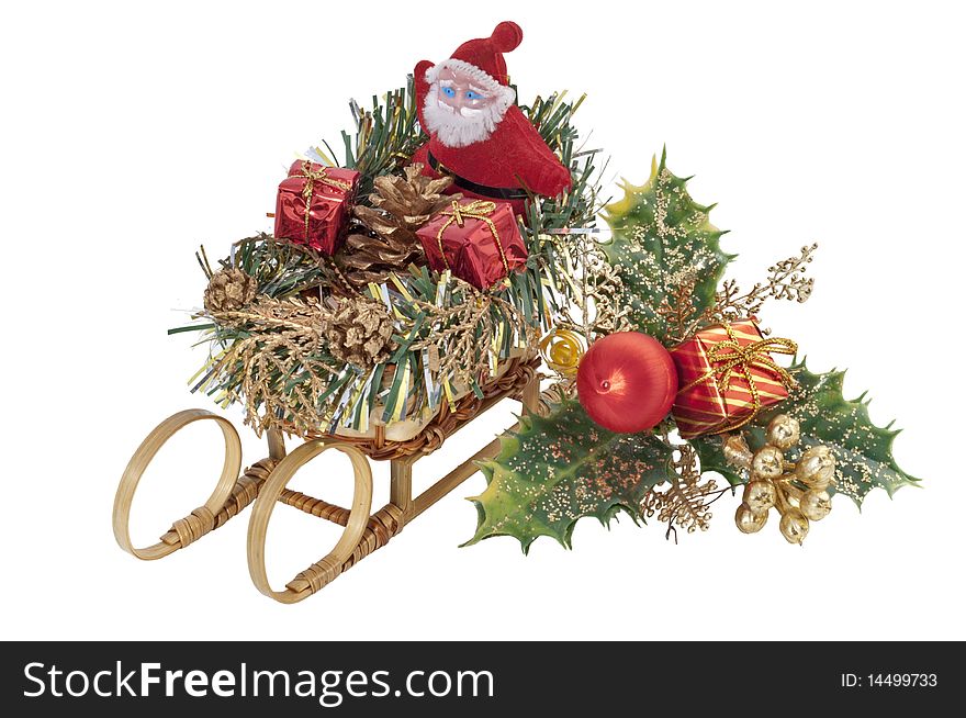 Santa Claus on a sleigh near an ornamental holly. Santa Claus on a sleigh near an ornamental holly