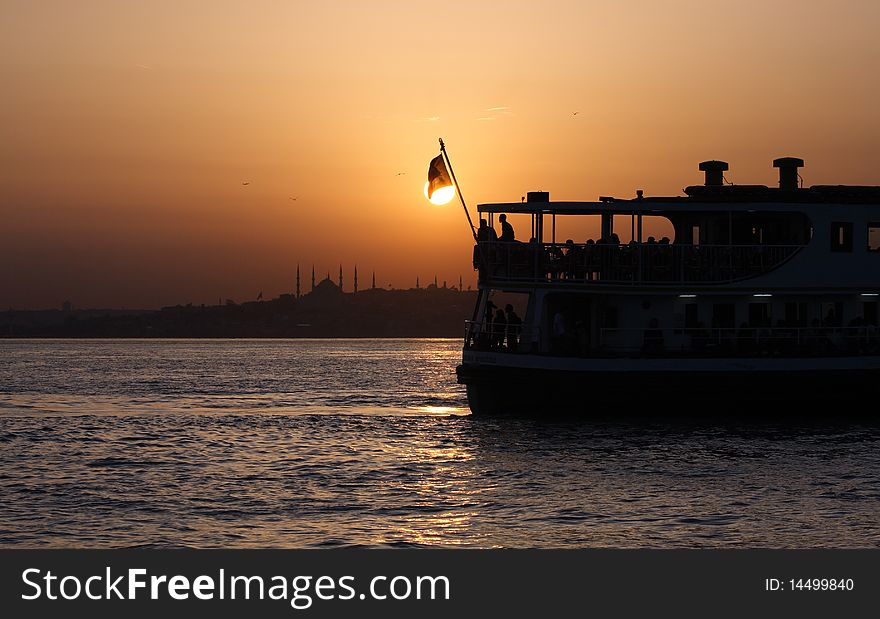 Passenger Ferry sailing across Bosporus during sunset. Istanbul, Turkey. Passenger Ferry sailing across Bosporus during sunset. Istanbul, Turkey