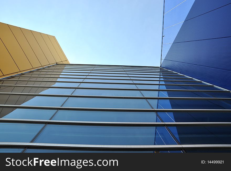 A Modern Commercial Building with blue sky background. A Modern Commercial Building with blue sky background