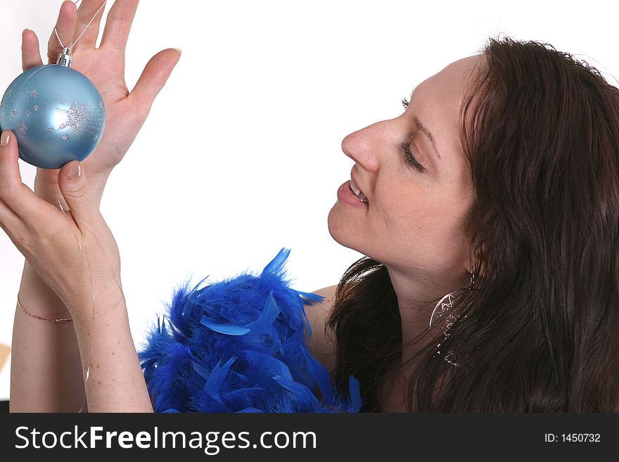 Portrait of a girl holding blue decoration bauble. Portrait of a girl holding blue decoration bauble