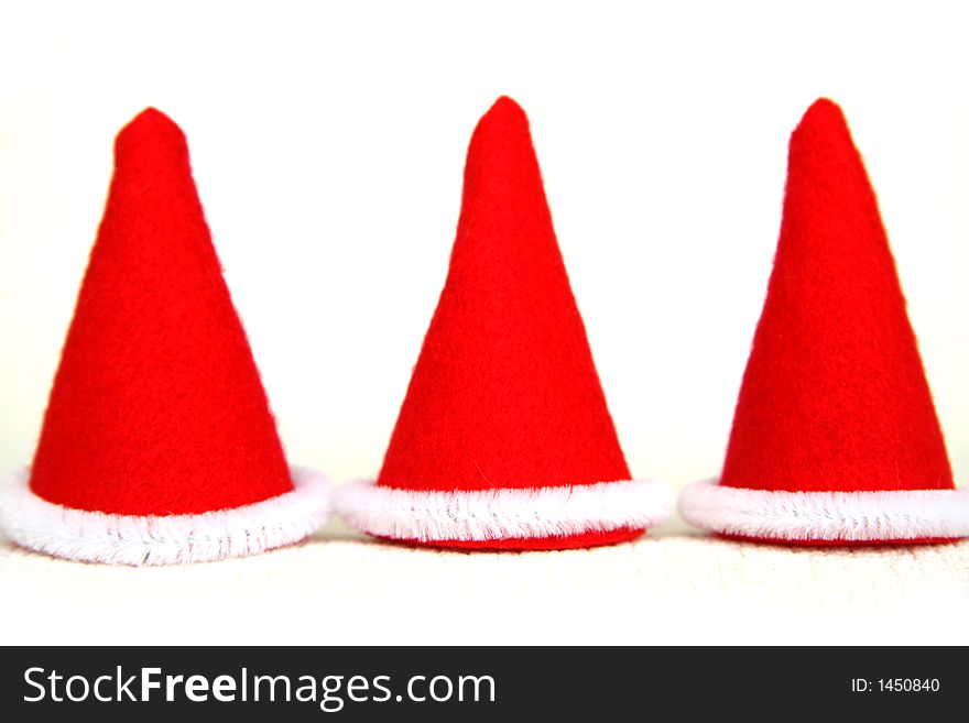 Three read hats of elf in christmas time. Three read hats of elf in christmas time