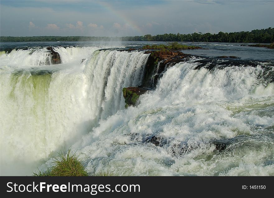 Devil´s throat at world largest Waterfalls Falls in Iguazu on a bright sunny day