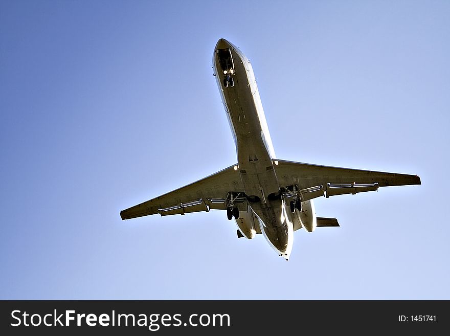 Underside of a jet as it approaches runway. Underside of a jet as it approaches runway.