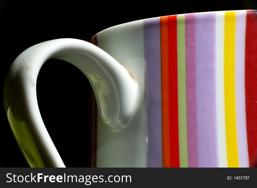 Clorful retro mug with black bacground from close