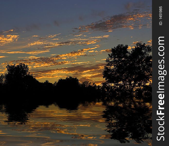 Beautiful sunset reflected in a body of water. Beautiful sunset reflected in a body of water