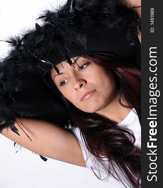 Beautiful Hispanic Woman in a feathered Hat. Beautiful Hispanic Woman in a feathered Hat
