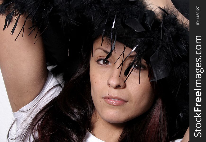 Beautiful Hispanic Woman in a feathered Hat. Beautiful Hispanic Woman in a feathered Hat