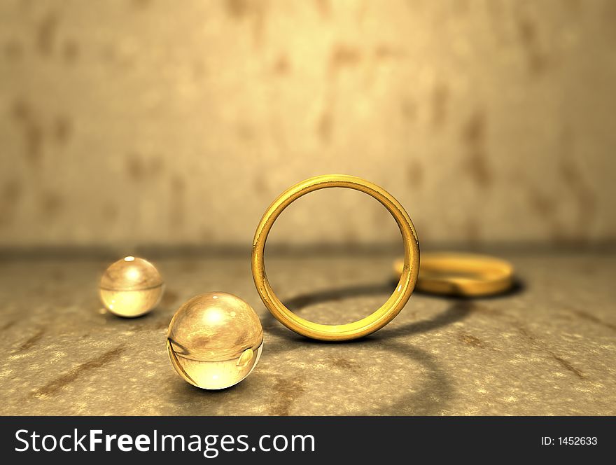 Image of Golden rings placed on a stony surface