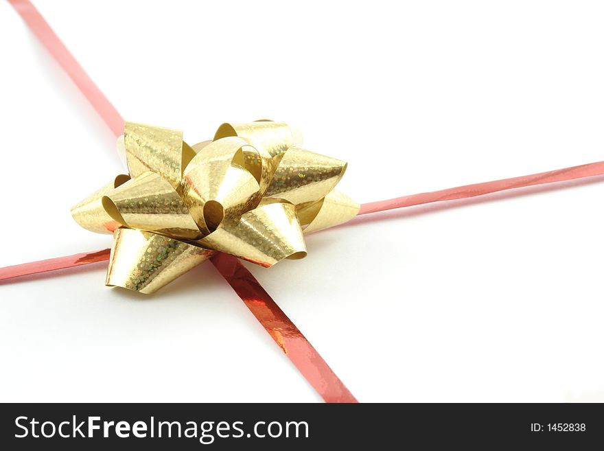 Gold gift ribbon on a white background