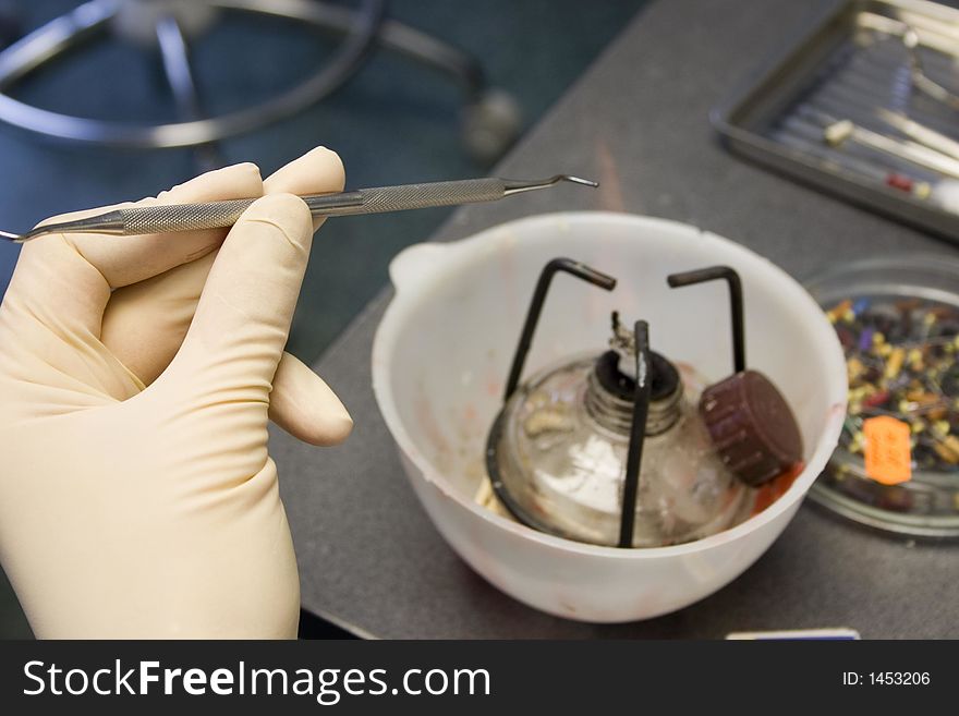 Dental tools and hands of dentist