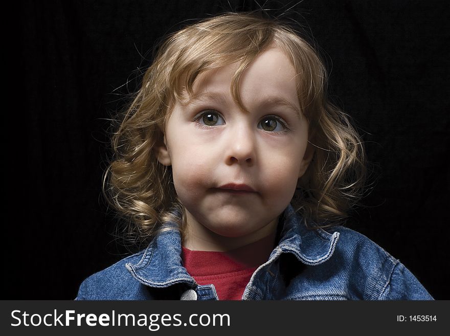 Two year old boy looking up