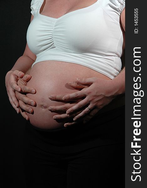 Pregnant woman and hands