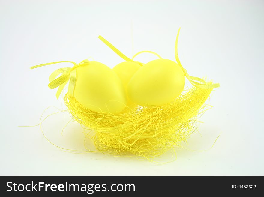 Yellow easter eggs on white background