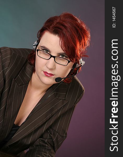 Girl with headset in front of colored background