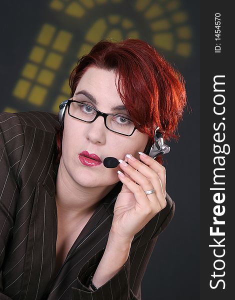 Girl with headset in front of yellow window. Girl with headset in front of yellow window