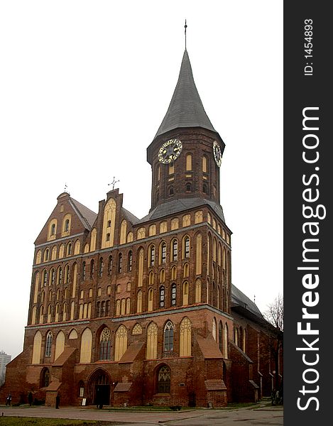 Catholic cathedral from red bricks, white sky