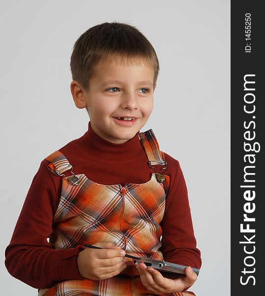 Smiling boy with Pocket PC in his hand