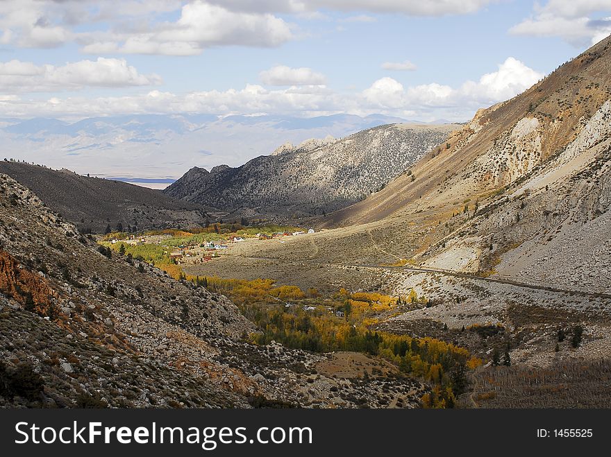 Small mountain community in autumn with colorful trees. Small mountain community in autumn with colorful trees